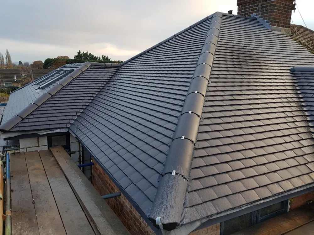 A finished hipped roof with new ridge and hip tiles